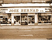 Façade of one of the first José Bernad, S.L. shops, with signs reading shop fittings, scales and machinery
