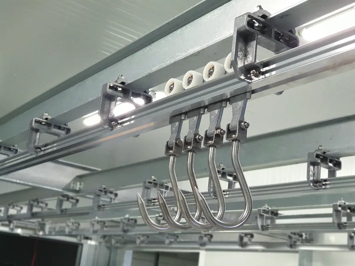Trolleys with stainless steel hooks on a twin track overhead rail