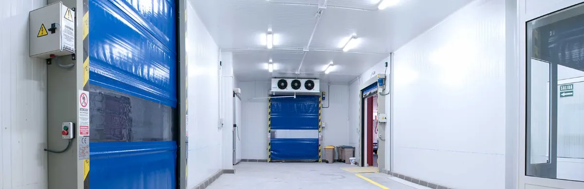 Cold room corridor with a blue door